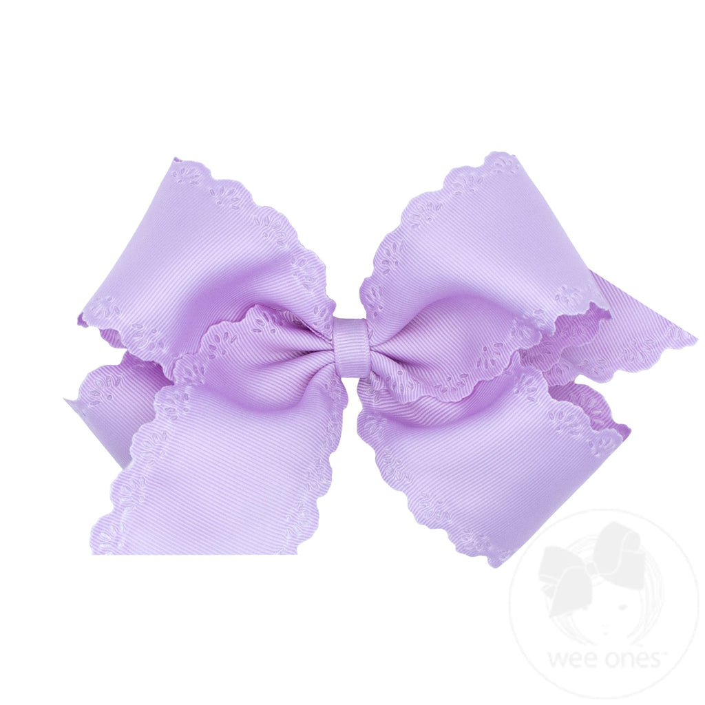 Small King Grosgrain Bow with Eyelet Flower Embossed Edges 
